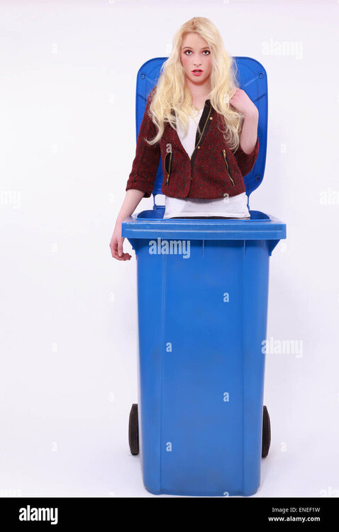 young-woman-posing-in-a-blue-garbage-can-ENEF1W.jpg